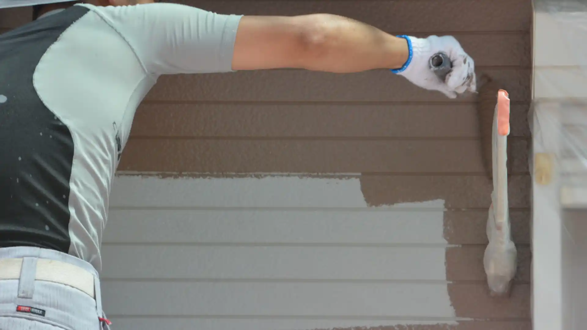 Residential home exterior with freshly painted siding and trim in coastal North Carolina, showing professional exterior painting work